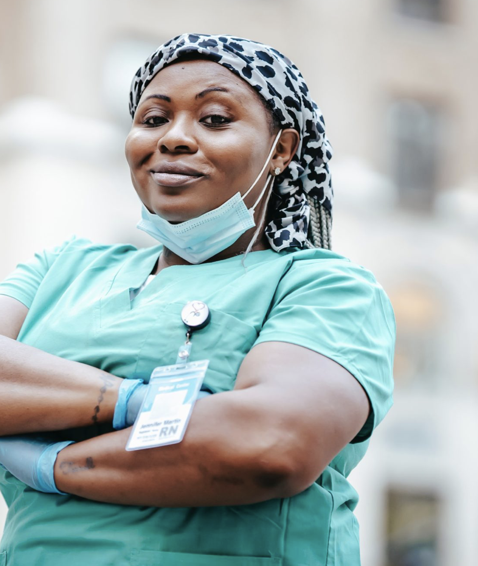 Female nurse with arms crossed and smiling